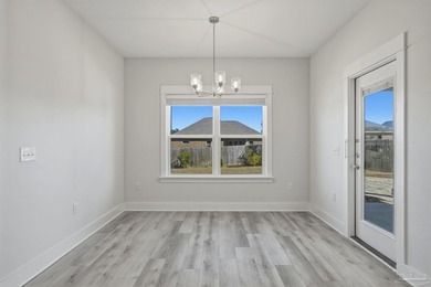 Built in 2021 and thoughtfully elevated beyond standard builds on Champion Golf Club in Florida - for sale on GolfHomes.com, golf home, golf lot