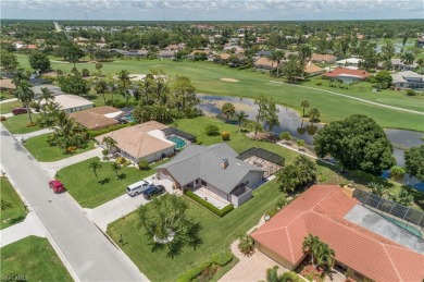 Tropical, lushly landscaped .27 acre lot with tranquil lagoon on Royal Palm Golf Club in Florida - for sale on GolfHomes.com, golf home, golf lot