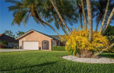 Tropical, lushly landscaped .27 acre lot with tranquil lagoon on Royal Palm Golf Club in Florida - for sale on GolfHomes.com, golf home, golf lot