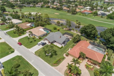 Tropical, lushly landscaped .27 acre lot with tranquil lagoon on Royal Palm Golf Club in Florida - for sale on GolfHomes.com, golf home, golf lot