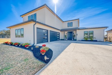 NEW TO MARKET: 2024 Modern Waterfront Masterpiece in Clearwater on Legends Golf Course in Texas - for sale on GolfHomes.com, golf home, golf lot