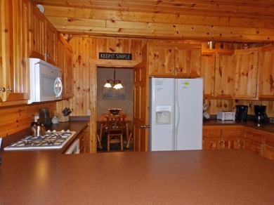 Welcome to this beautifully maintained Northern Michigan getaway on Michaywe Pines Course in Michigan - for sale on GolfHomes.com, golf home, golf lot