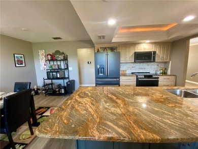 Located in the desirable Highland Lakes community, this on Highland Lakes Executive Golf Course in Florida - for sale on GolfHomes.com, golf home, golf lot