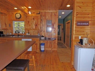Welcome to this beautifully maintained Northern Michigan getaway on Michaywe Pines Course in Michigan - for sale on GolfHomes.com, golf home, golf lot