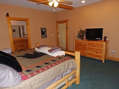 Welcome to this beautifully maintained Northern Michigan getaway on Michaywe Pines Course in Michigan - for sale on GolfHomes.com, golf home, golf lot