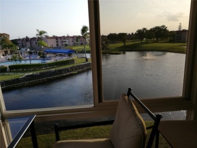 MILLION-DOLLAR VIEWS OF THE LAKE, GOLF COURSES, AND THE on Sunrise Lakes Phase III in Florida - for sale on GolfHomes.com, golf home, golf lot