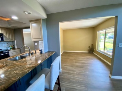 Located in the desirable Highland Lakes community, this on Highland Lakes Executive Golf Course in Florida - for sale on GolfHomes.com, golf home, golf lot