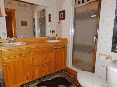 Welcome to this beautifully maintained Northern Michigan getaway on Michaywe Pines Course in Michigan - for sale on GolfHomes.com, golf home, golf lot