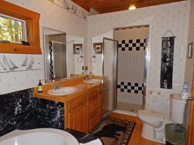 Welcome to this beautifully maintained Northern Michigan getaway on Michaywe Pines Course in Michigan - for sale on GolfHomes.com, golf home, golf lot
