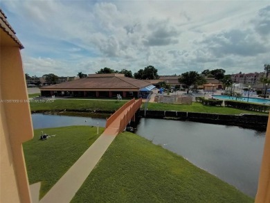 MILLION-DOLLAR VIEWS OF THE LAKE, GOLF COURSES, AND THE on Sunrise Lakes Phase III in Florida - for sale on GolfHomes.com, golf home, golf lot