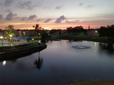 MILLION-DOLLAR VIEWS OF THE LAKE, GOLF COURSES, AND THE on Sunrise Lakes Phase III in Florida - for sale on GolfHomes.com, golf home, golf lot