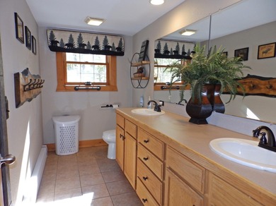 Welcome to this beautifully maintained Northern Michigan getaway on Michaywe Pines Course in Michigan - for sale on GolfHomes.com, golf home, golf lot