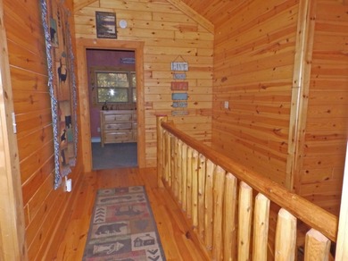 Welcome to this beautifully maintained Northern Michigan getaway on Michaywe Pines Course in Michigan - for sale on GolfHomes.com, golf home, golf lot