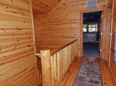 Welcome to this beautifully maintained Northern Michigan getaway on Michaywe Pines Course in Michigan - for sale on GolfHomes.com, golf home, golf lot