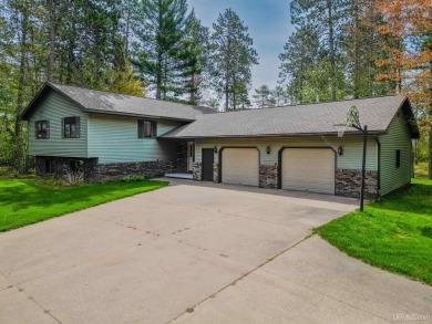 Awesome river setting with over 1,000' of Chocolay River on Northern Michigan University Golf Course (NMU) in Michigan - for sale on GolfHomes.com, golf home, golf lot