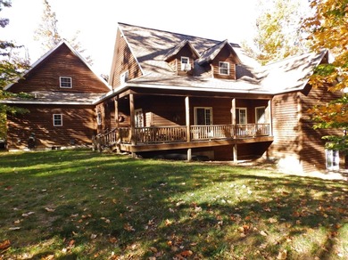 Welcome to this beautifully maintained Northern Michigan getaway on Michaywe Pines Course in Michigan - for sale on GolfHomes.com, golf home, golf lot