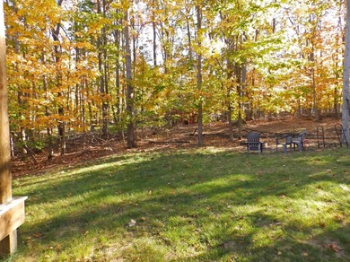 Welcome to this beautifully maintained Northern Michigan getaway on Michaywe Pines Course in Michigan - for sale on GolfHomes.com, golf home, golf lot