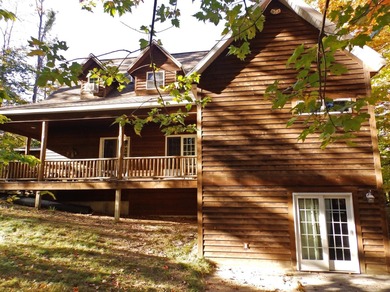 Welcome to this beautifully maintained Northern Michigan getaway on Michaywe Pines Course in Michigan - for sale on GolfHomes.com, golf home, golf lot