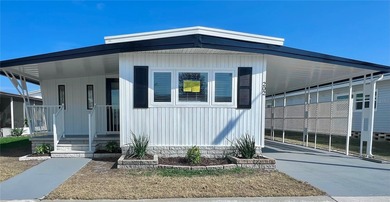 Welcome home to a truly exceptional renovation where modern on Fairway Village Golf Course in Florida - for sale on GolfHomes.com, golf home, golf lot