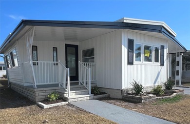 Welcome home to a truly exceptional renovation where modern on Fairway Village Golf Course in Florida - for sale on GolfHomes.com, golf home, golf lot