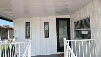 Welcome home to a truly exceptional renovation where modern on Fairway Village Golf Course in Florida - for sale on GolfHomes.com, golf home, golf lot