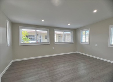 Welcome home to a truly exceptional renovation where modern on Fairway Village Golf Course in Florida - for sale on GolfHomes.com, golf home, golf lot