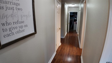 Beautiful home perched on a hill overlooking a scenic view of on Hide-A-Way Lake Golf Course in Texas - for sale on GolfHomes.com, golf home, golf lot