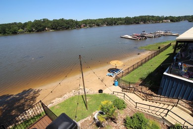 Beautiful home perched on a hill overlooking a scenic view of on Hide-A-Way Lake Golf Course in Texas - for sale on GolfHomes.com, golf home, golf lot