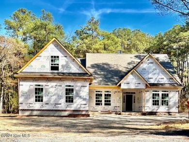 Welcome to this stunning 4-bedroom, 4-bathroom home nestled on a on Pinewild Country Club of Pinehurst in North Carolina - for sale on GolfHomes.com, golf home, golf lot