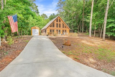 Discover a newer home opposite Hartwell Lake, boasting seasonal on The Trail At Chickasaw Pointe in South Carolina - for sale on GolfHomes.com, golf home, golf lot