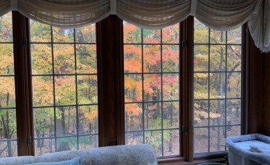 Near the school and tucked in a cul-de-sac, the original builder on Goodrich Country Club in Michigan - for sale on GolfHomes.com, golf home, golf lot