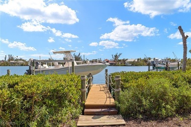 Stunning Waterfront Elevated 3-Story Home with Breathtaking on The Sanctuary Golf Club in Florida - for sale on GolfHomes.com, golf home, golf lot