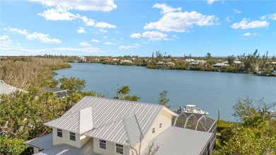 Stunning Waterfront Elevated 3-Story Home with Breathtaking on The Sanctuary Golf Club in Florida - for sale on GolfHomes.com, golf home, golf lot