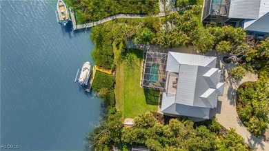 Stunning Waterfront Elevated 3-Story Home with Breathtaking on The Sanctuary Golf Club in Florida - for sale on GolfHomes.com, golf home, golf lot