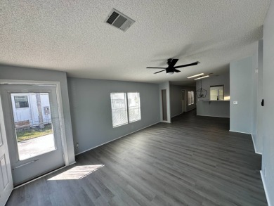 Beautifully renovated 2 bedroom, 2 bathroom home.  The home is on Del Tura Golf and Country Club in Florida - for sale on GolfHomes.com, golf home, golf lot