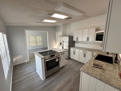 Beautifully renovated 2 bedroom, 2 bathroom home.  The home is on Del Tura Golf and Country Club in Florida - for sale on GolfHomes.com, golf home, golf lot