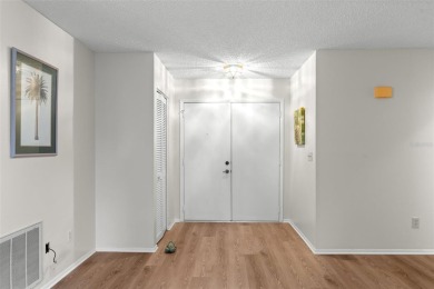 One or more photo(s) has been virtually staged. Nestled in on Highland Lakes Executive Golf Course in Florida - for sale on GolfHomes.com, golf home, golf lot