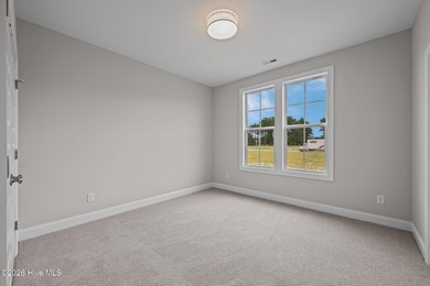 The Coventry welcomes you home. This newly-constructed 3-bedroom on Carolina Colours Golf Club in North Carolina - for sale on GolfHomes.com, golf home, golf lot