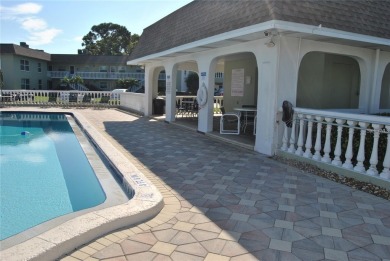 Amazing location in a 55+ community with a Sparkling Heated pool on Tarpon Springs Golf Course in Florida - for sale on GolfHomes.com, golf home, golf lot