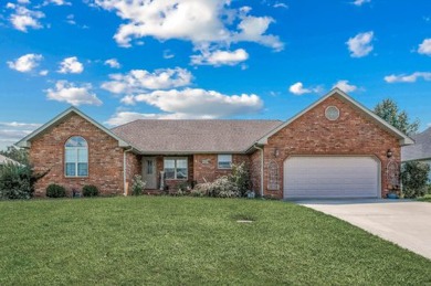 Welcome to this 3-bedroom, 2.5-bathroom home nestled within a on Marshfield Country Club in Missouri - for sale on GolfHomes.com, golf home, golf lot