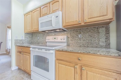 This 1,489 square foot is awaiting your updates. Enter through on Tampa Bay Golf and Country Club in Florida - for sale on GolfHomes.com, golf home, golf lot