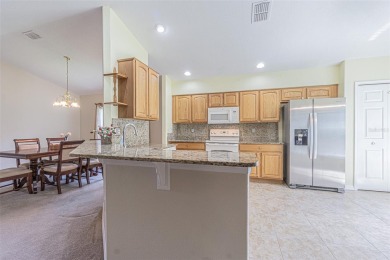 This 1,489 square foot is awaiting your updates. Enter through on Tampa Bay Golf and Country Club in Florida - for sale on GolfHomes.com, golf home, golf lot
