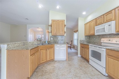 This 1,489 square foot is awaiting your updates. Enter through on Tampa Bay Golf and Country Club in Florida - for sale on GolfHomes.com, golf home, golf lot