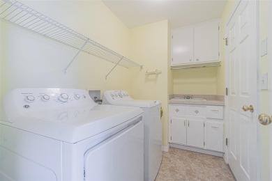 This 1,489 square foot is awaiting your updates. Enter through on Tampa Bay Golf and Country Club in Florida - for sale on GolfHomes.com, golf home, golf lot