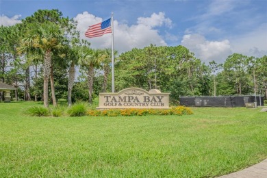This 1,489 square foot is awaiting your updates. Enter through on Tampa Bay Golf and Country Club in Florida - for sale on GolfHomes.com, golf home, golf lot