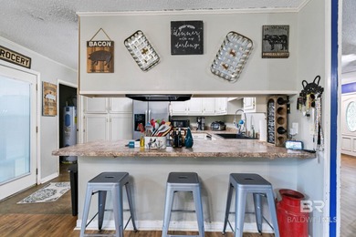 Step inside this spacious 4-bedroom, 2-bath ranch-style home on on Lake Forest Yacht and Country Club in Alabama - for sale on GolfHomes.com, golf home, golf lot