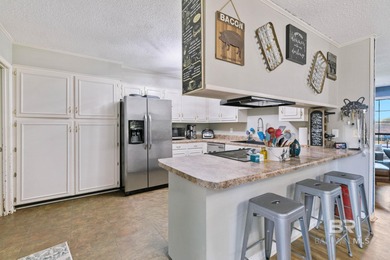 Step inside this spacious 4-bedroom, 2-bath ranch-style home on on Lake Forest Yacht and Country Club in Alabama - for sale on GolfHomes.com, golf home, golf lot