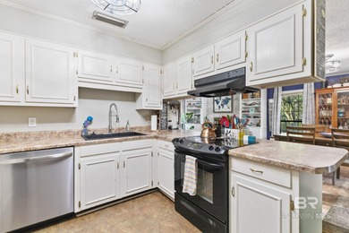 Step inside this spacious 4-bedroom, 2-bath ranch-style home on on Lake Forest Yacht and Country Club in Alabama - for sale on GolfHomes.com, golf home, golf lot