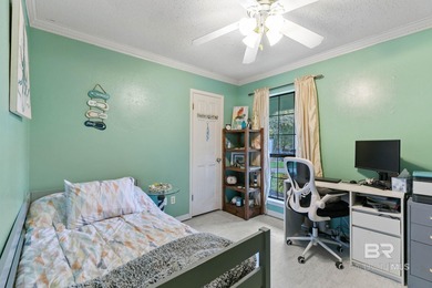 Step inside this spacious 4-bedroom, 2-bath ranch-style home on on Lake Forest Yacht and Country Club in Alabama - for sale on GolfHomes.com, golf home, golf lot