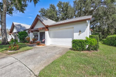 Welcome to this stunning two bedroom, two bath villa nestled in on Highland Lakes Executive Golf Course in Florida - for sale on GolfHomes.com, golf home, golf lot